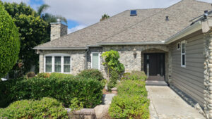 Front entrance of stone facade home photographed in San Diego